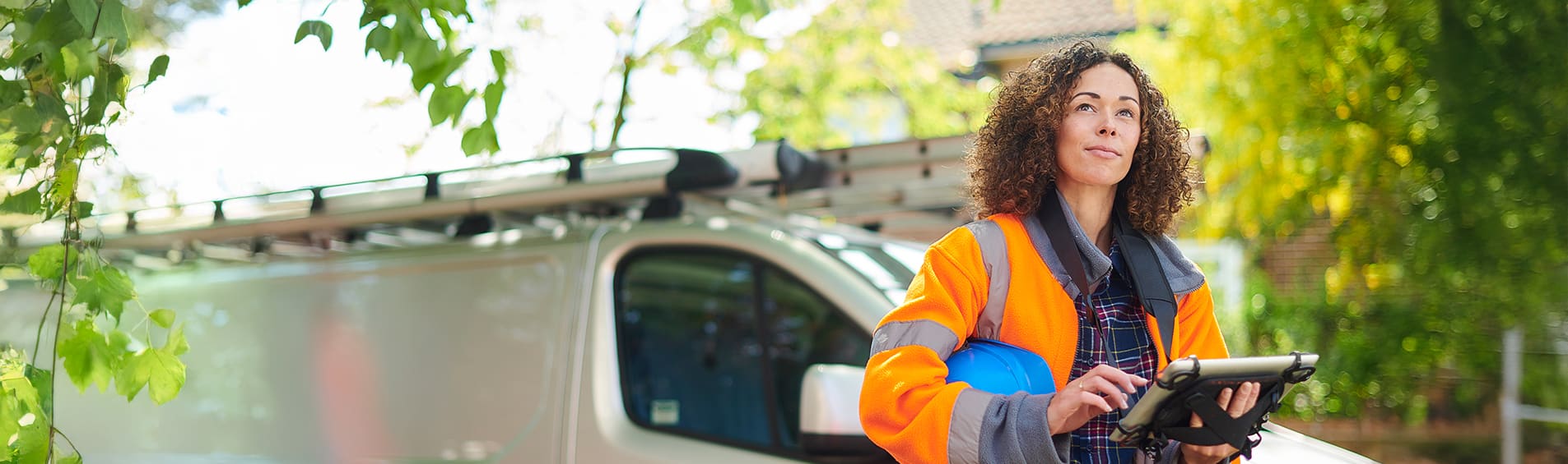 Female heating engineer arrives at job